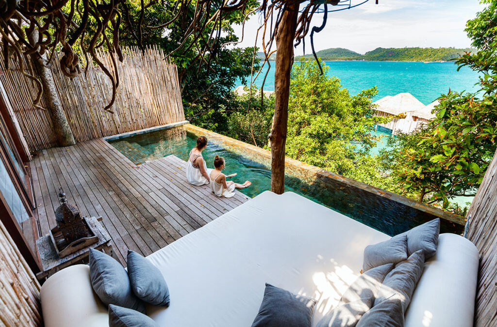 boutique hotel balcony with pool facing beach view resort