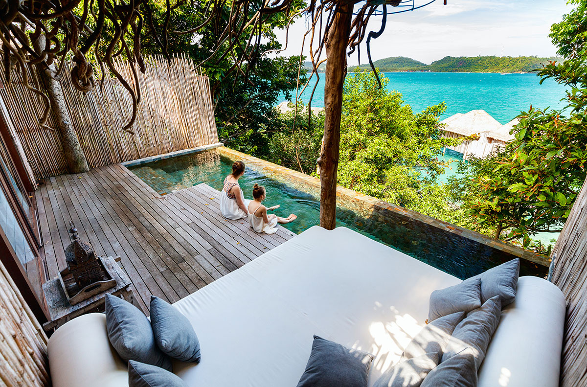 boutique hotel balcony with pool facing beach view resort